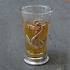 Shot Glass with pewter base and badge